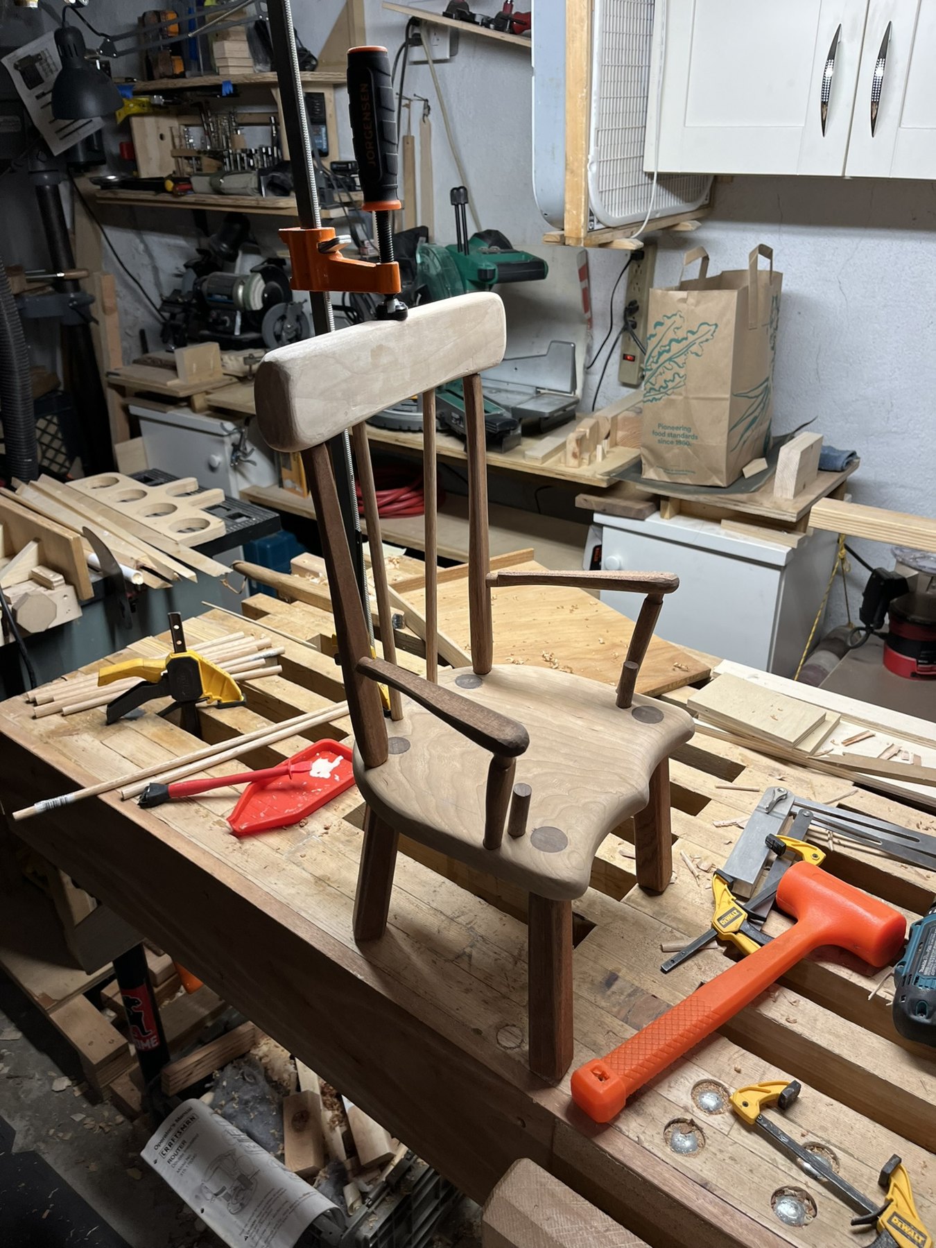 Unfinished stick chair assembled at the workbench