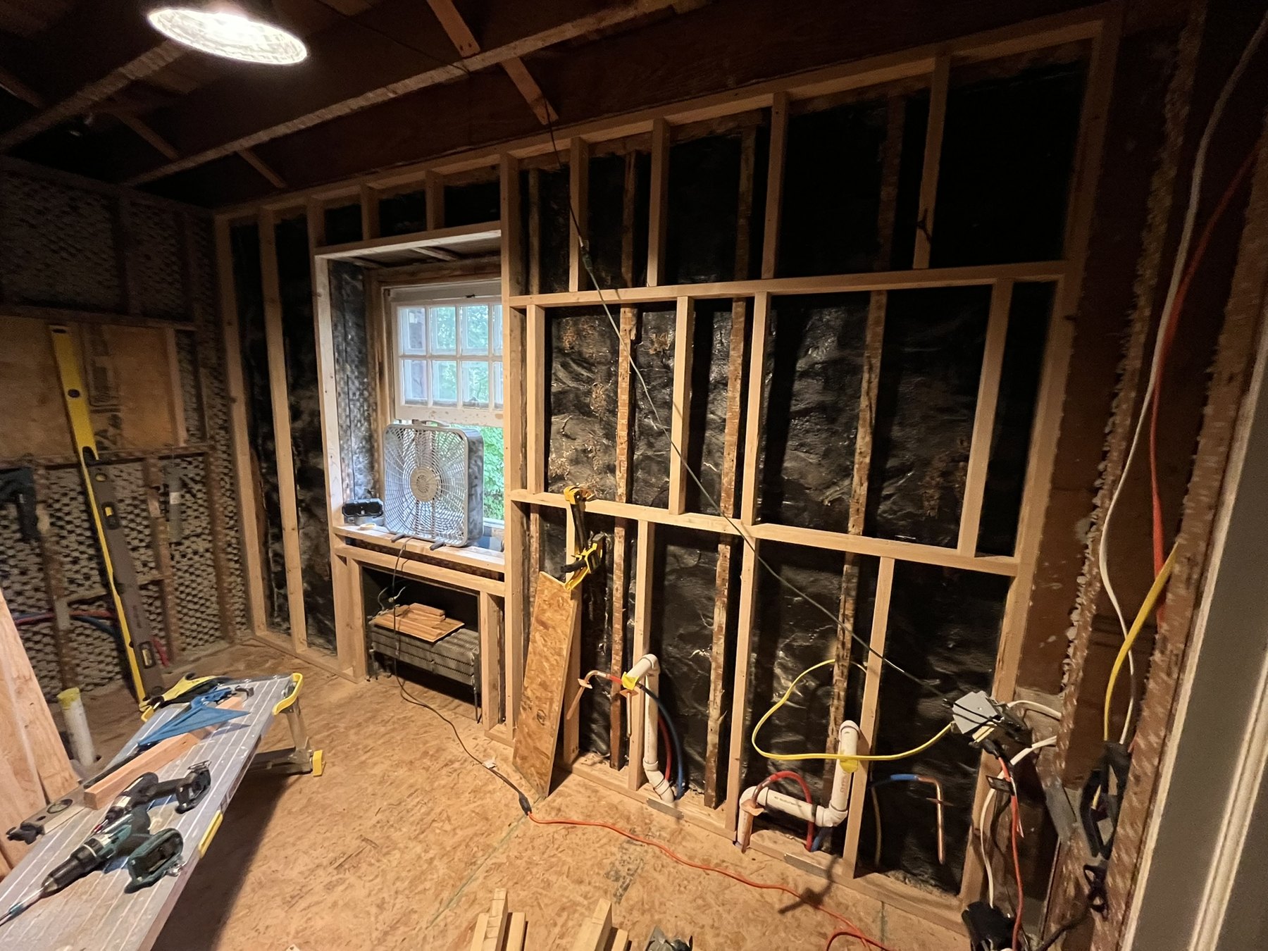 Exposed framing around the bathroom window before finishes