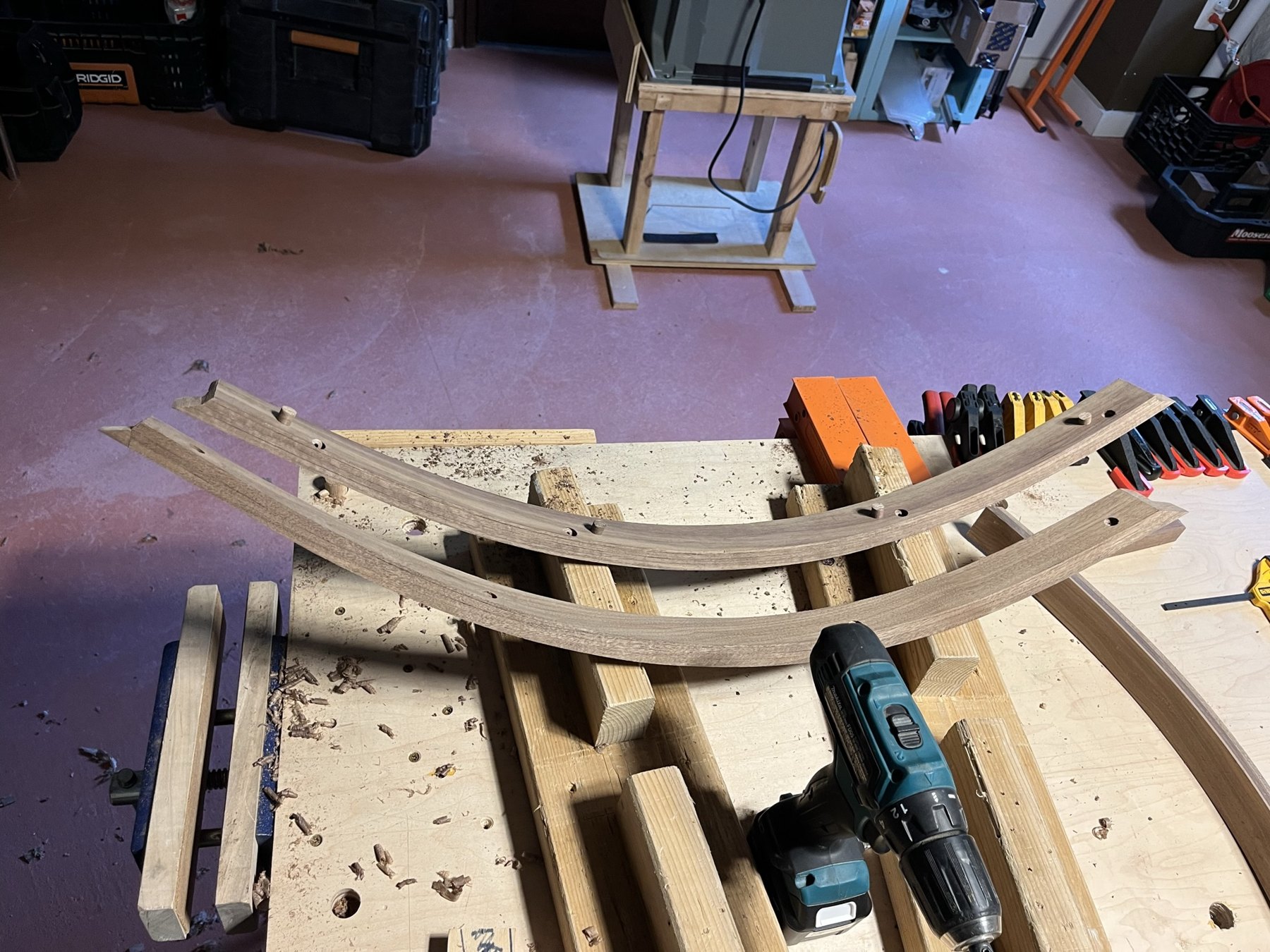 Two curved wood trim pieces fitted and shaped at the bench