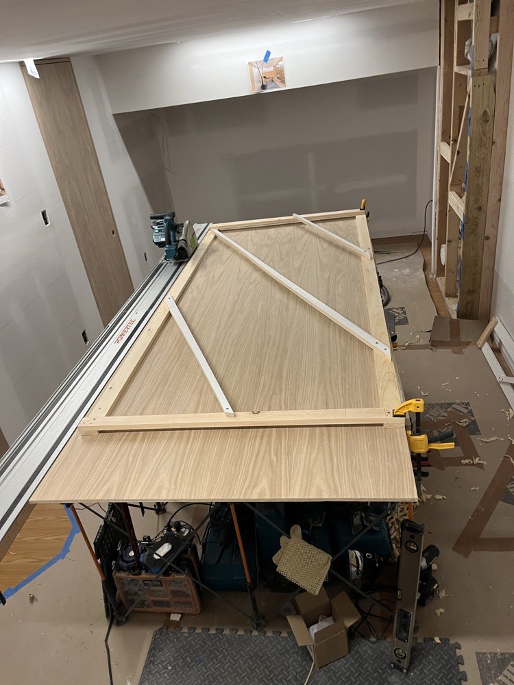 Open timber construction on the back of an oak veneered assembly during fabrication