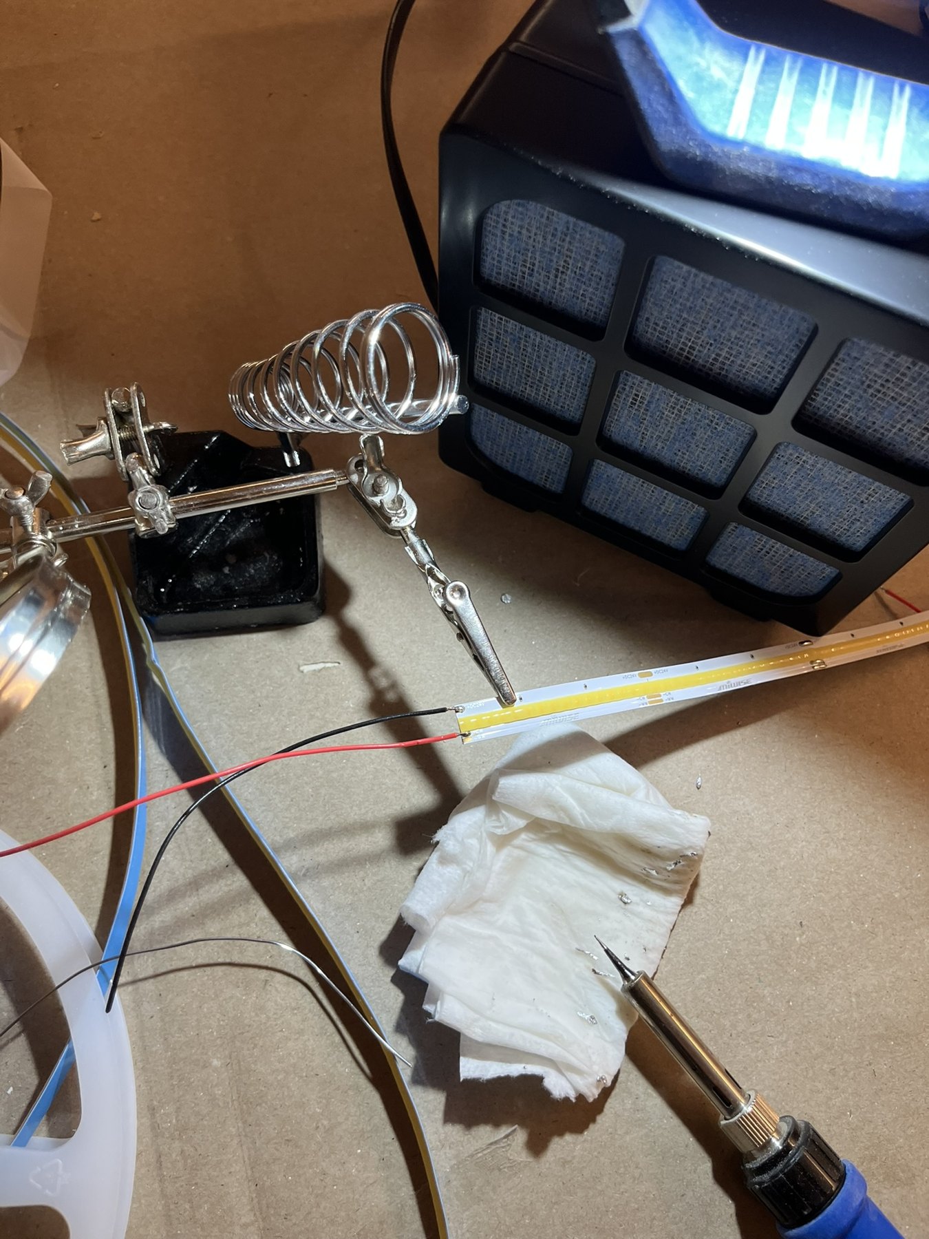 Soldering equipment and a narrow LED strip on the site workbench