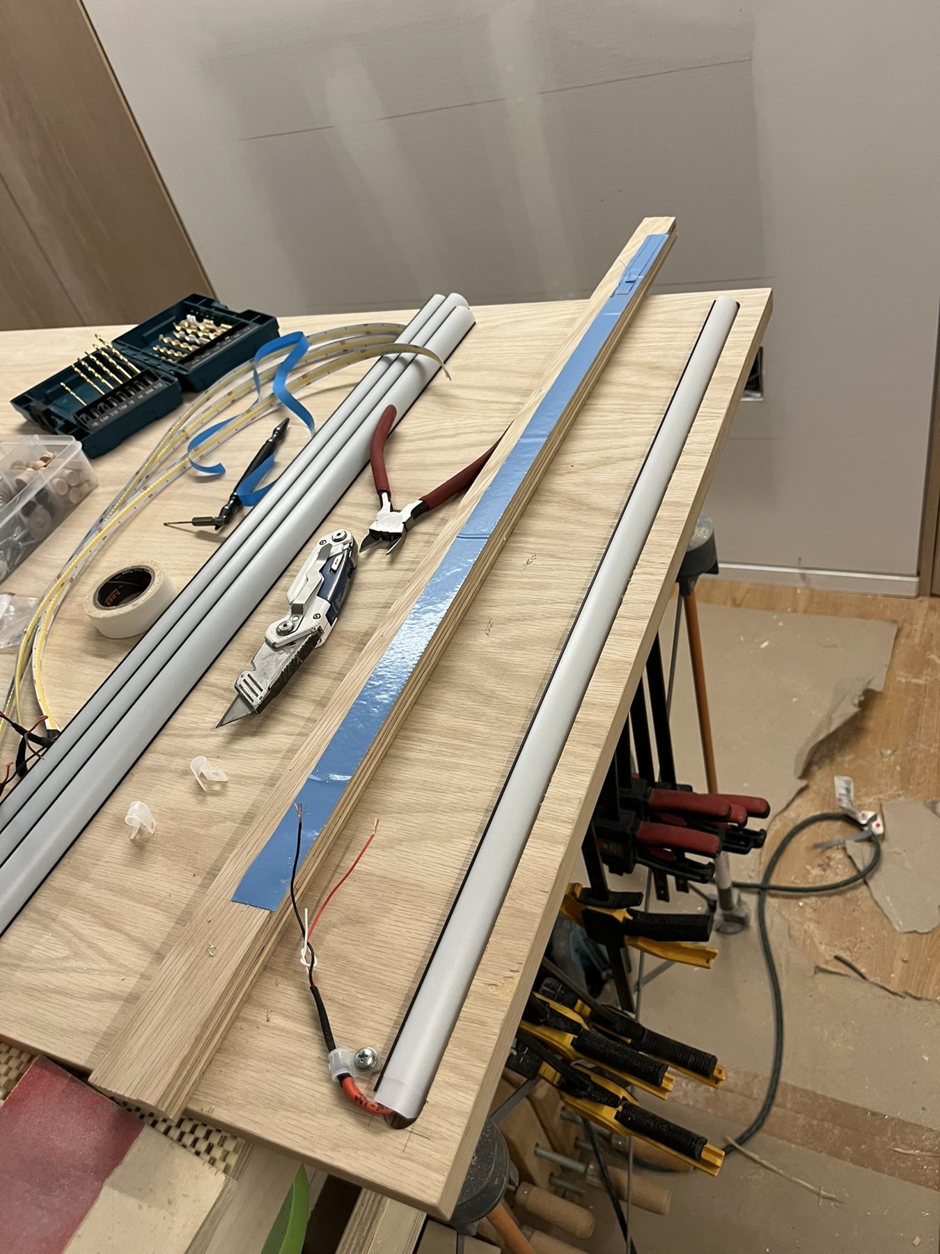 LED diffuser track fitted along the back of an oak panel